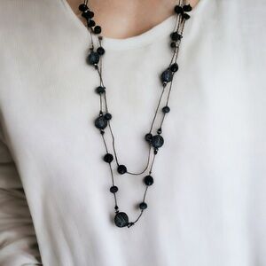 Long elegant black necklace with net over glass beads